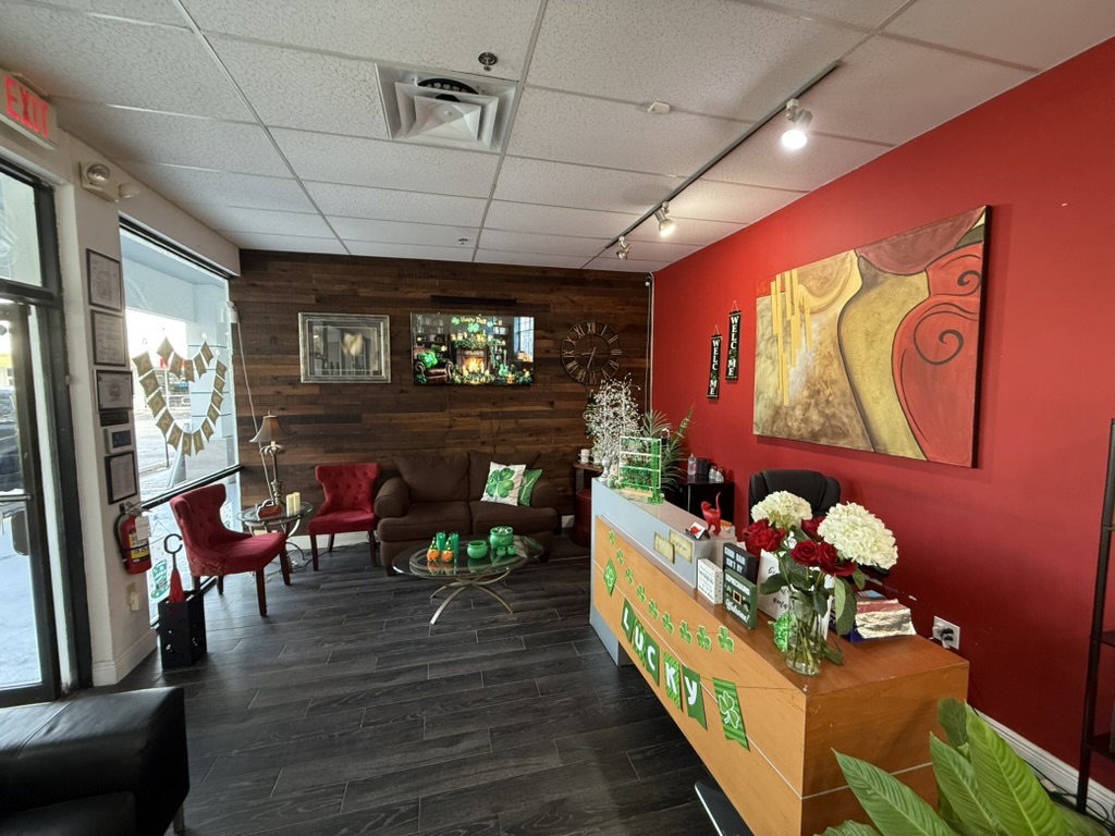 Salon Rouge II reception and waiting area with red velvet chairs